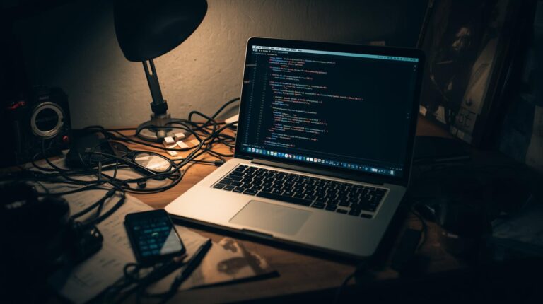Developer workspace with code editor illustrating how is vibe coding different from pair programming development approach