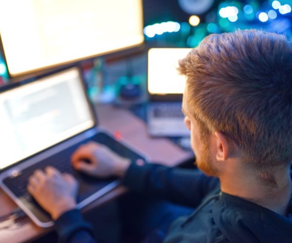 programmer-using-laptop-and-pc-information-coding.jpg programmer-using-laptop-and-pc-information-coding.jpg